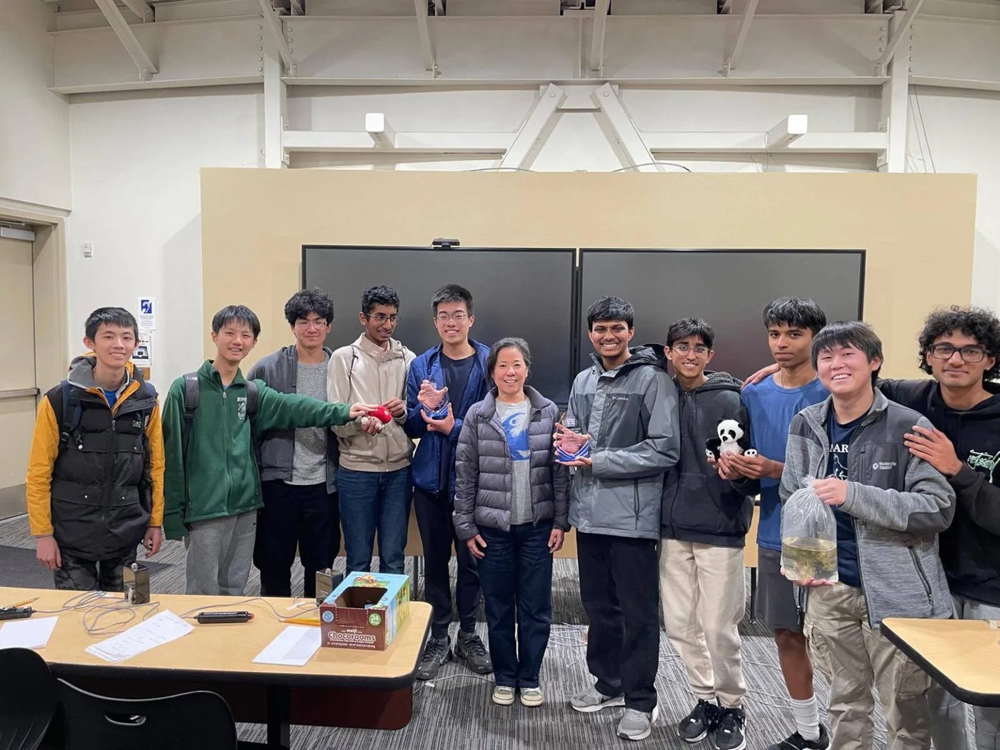 The Ocean Science Bowl team posing with trophies and stuffed-animal prizes after the Sea Lion Bowl
